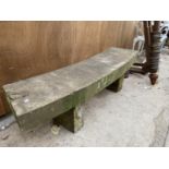 A CURVED STONE BENCH WITH PEDASTEL BASE