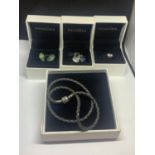A BOXED PANDORA DOUBLE LEATHER BRACELET WITH FIVE VARIOUS CHARMS IN THREE BOXES