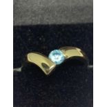 A 9 CARAT GOLD WISHBONE RING WITH AN AQUAMARINE SIZE M WITH A HEART SHAPED PRESENTATION BOX