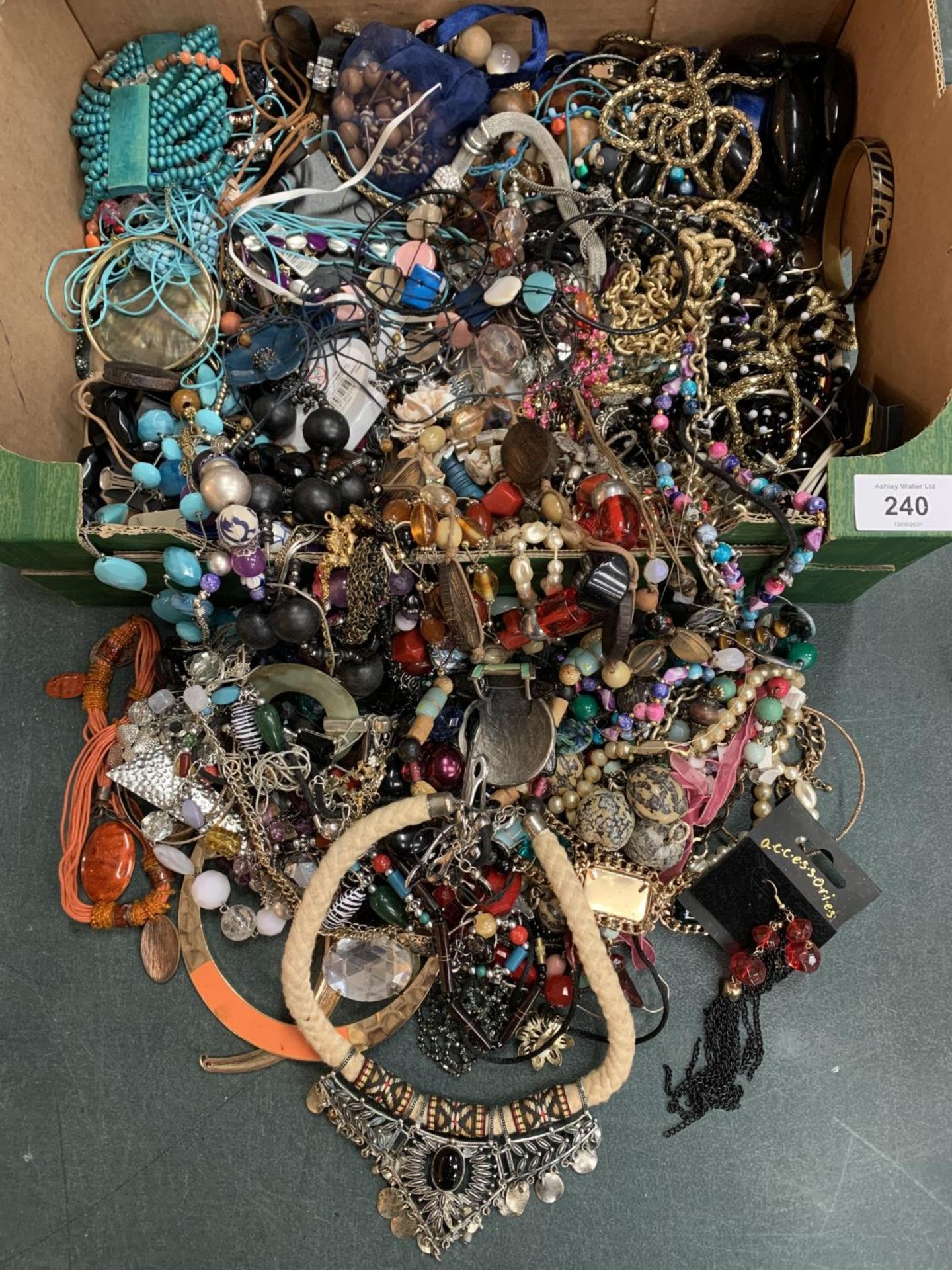 A BOX OF COSTUME JEWELLRY