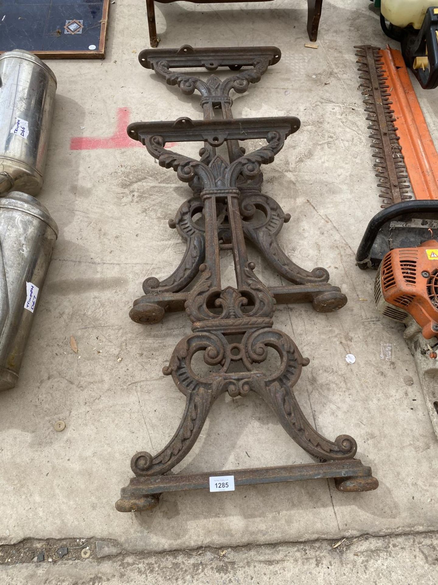 A PAIR OF HEAVY CAST IRON TABLE BASES