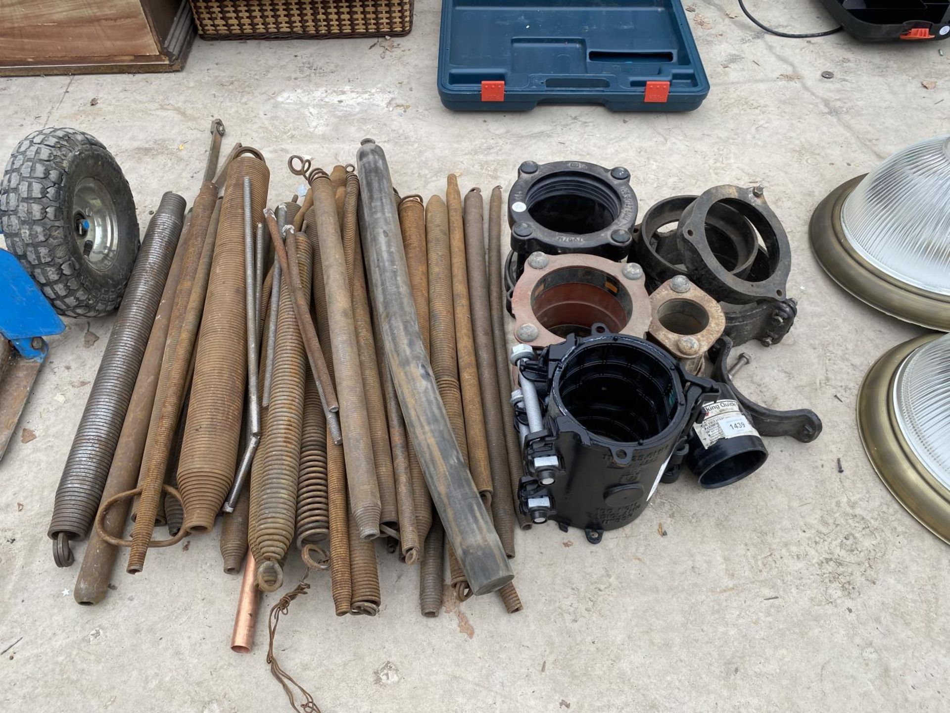 A LARGE QUANTITY OF PIPE BENDING SPRINGS AND AN ASSORTMENT OF PIPE COUPLINGS