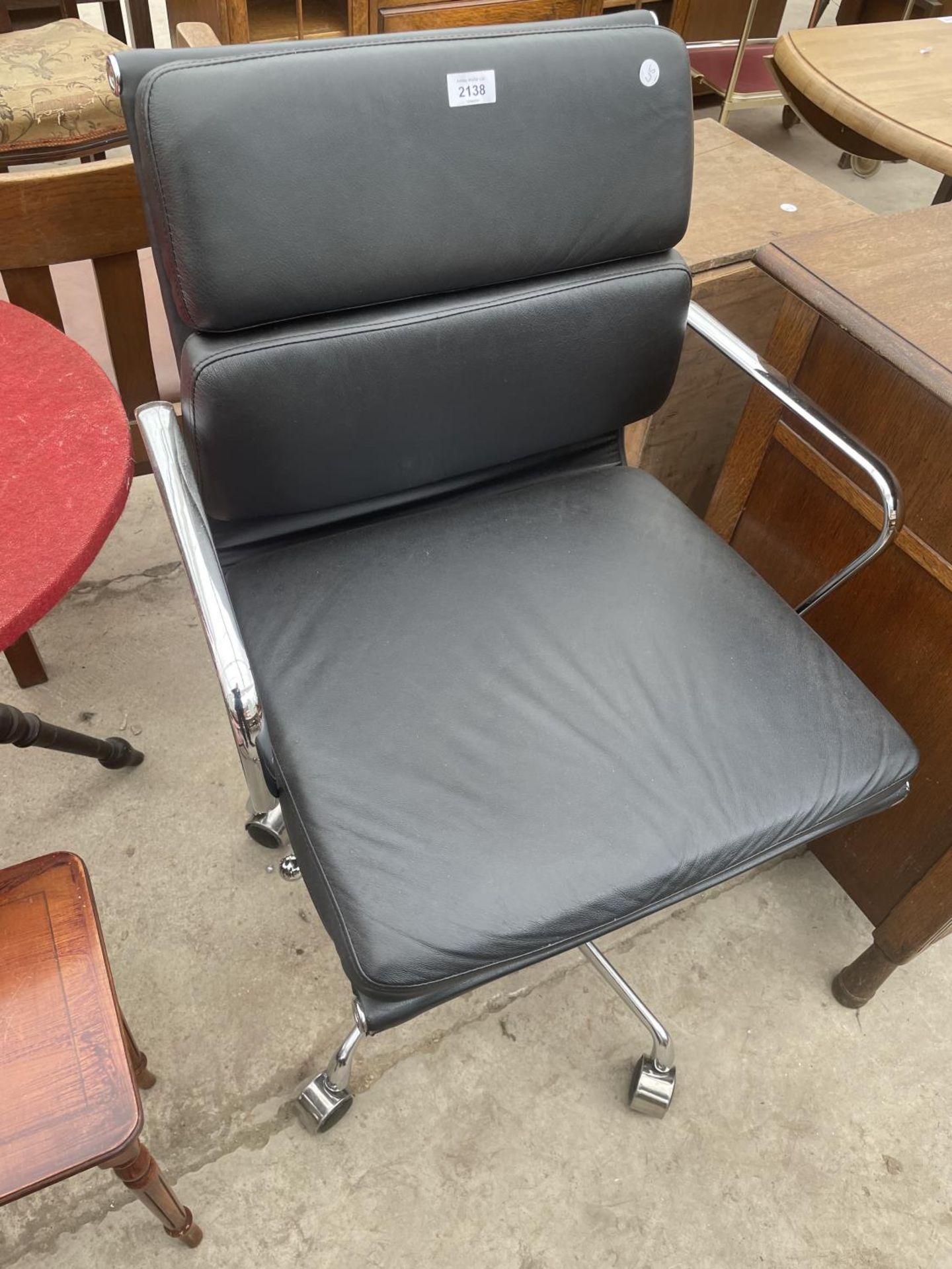 AN EAMES STYLES SWIVEL OFFICE ARM CHAIR AND CHROME BASE