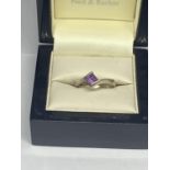 A MODERN STYLE 9 CARAT WHITE GOLD RING WITH A SQUARE AMETHYST STONE SIZE M IN A PRESENTATION BOX