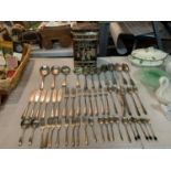 A LARGE SELECTION OF FLATWARE INCLUDING SERVING SPOONS, FISH KNIVES AND CAKE FORKS