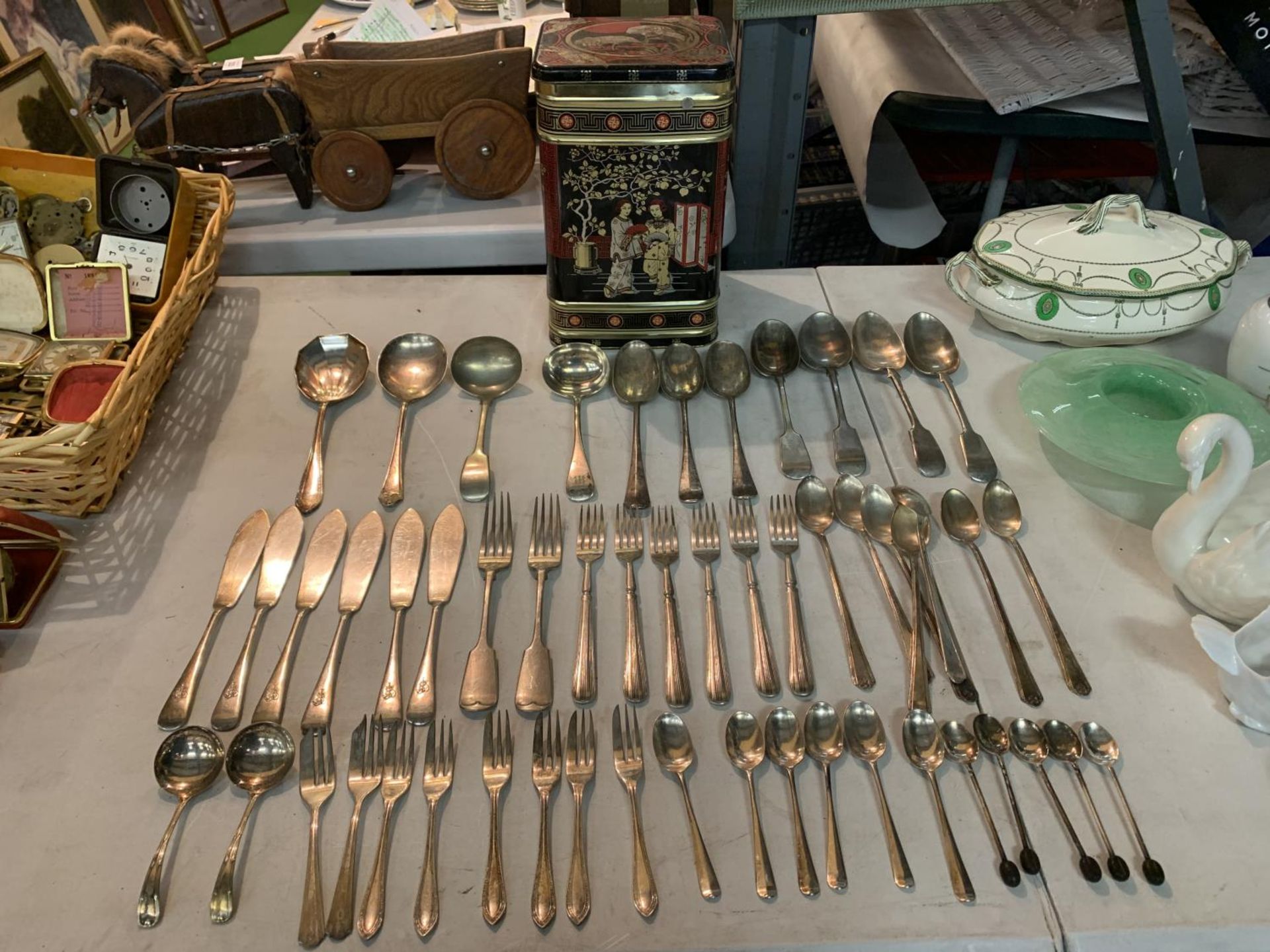 A LARGE SELECTION OF FLATWARE INCLUDING SERVING SPOONS, FISH KNIVES AND CAKE FORKS