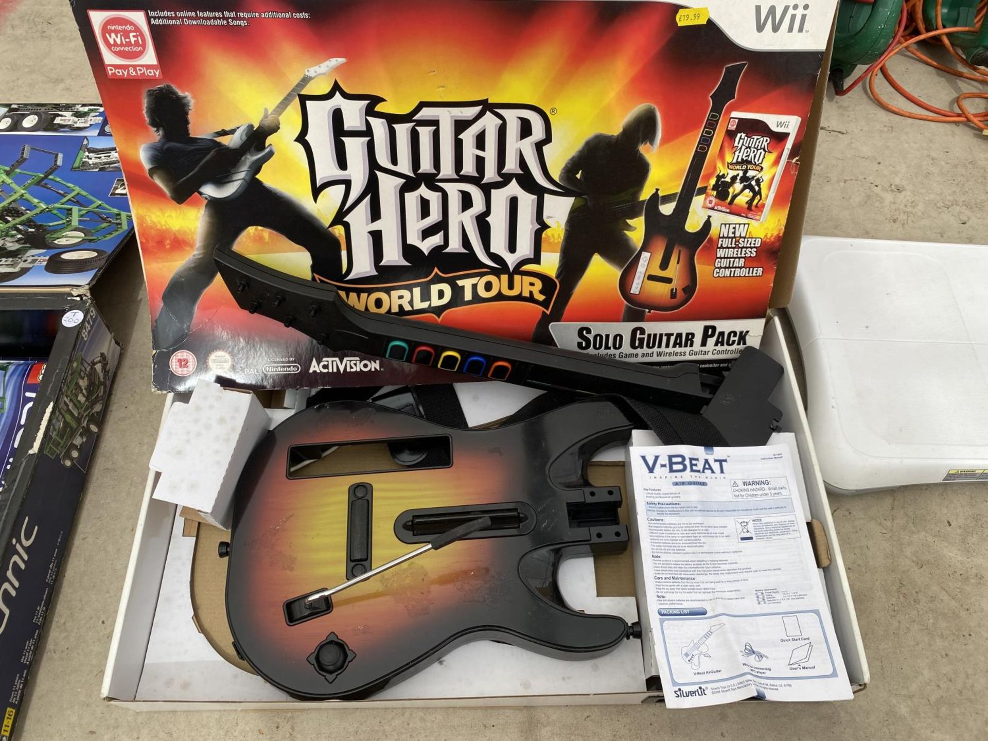 TWO NINTENDO WIIS A WII FIT BOARD AND A WII GUITAR HERO AND A QUANTITY OF GAMES - Image 4 of 4