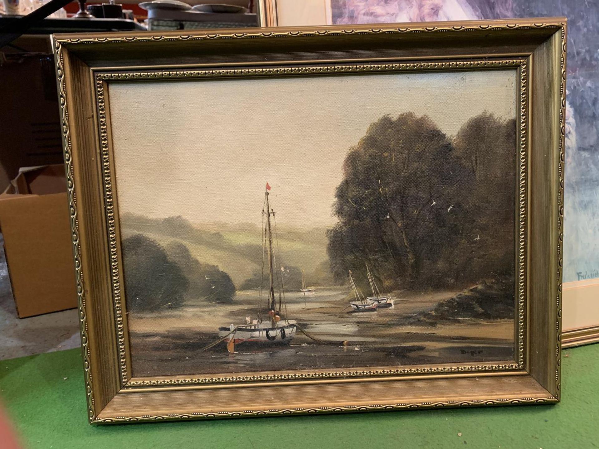 A GILT FRAMED OIL ON CANVAS DEPICTING A BOATING SCENE