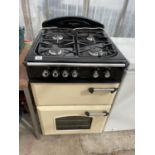 A CREAM AND BLACK LEISURE FREE STANDING COOKER AND HOB BELIEVED WORKING BUT NO WARRANTY