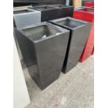 A PAIR OF SQUARE BLACK FIBRE GLASS PLANTERS (H:80CM)