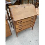 A RETRO TEAK BUREAU WITH FALL FRONT AND THREE DRAWERS