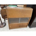 A RETRO OAK BUREAU WITH FALL FRONT AND FOUR SLIDING DOORS - 36" WIDE