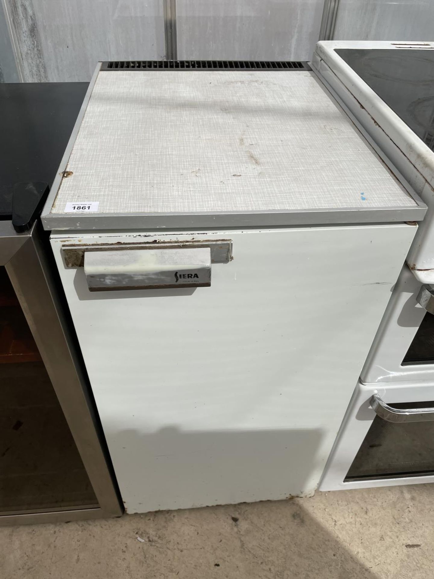 A WHITE SIERA UNDER COUNTER FRIDGE BELIEVED IN WORKING ORDER BUT NO WARRANTY