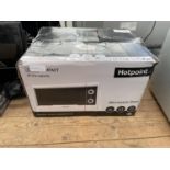 A WHITE HOTPOINT MICROWAVE OVEN