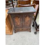 A SMALL GEORGE III CROSSBANDED OAK CABINET ON BRACKET FEET WITH TWO ARCHED PANEL DOORS, SINGLE