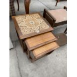 A NEST OF THREE G-PLAN RETRO TEAK TABLES, THE MAIN TABLE INSET WITH TILE