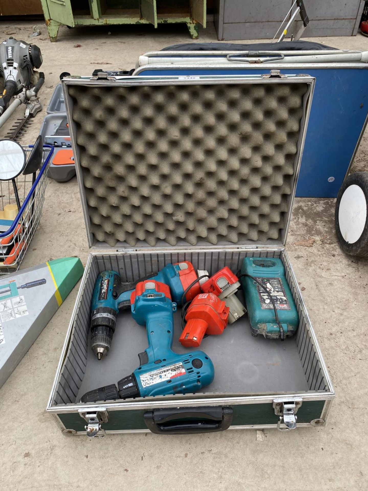 A PAIR OF 12V MAKITA WITH CHARGER AND TWO SPARE BATTERIES