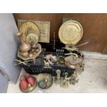 A LARGE ASSORTMENT OF BRASS WARE TO INCLUDE CHARGERS, CANDLESTICKS AND FIGURES ETC