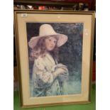 A GILT FRAMED PICTURE DEPICTING A GIRL HOLDING A RABBIT