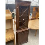 A MODERN MAHOGANY CORNER CUPBOARD