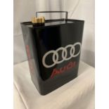 A BLACK METAL 'AUDI' FUEL CAN WITH A BRASS LID