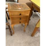 A MID 20TH CENTURY SATINWOOD BEDSIDE THREE DRAWER CHEST ON CABRIOLE LEGS W:14"