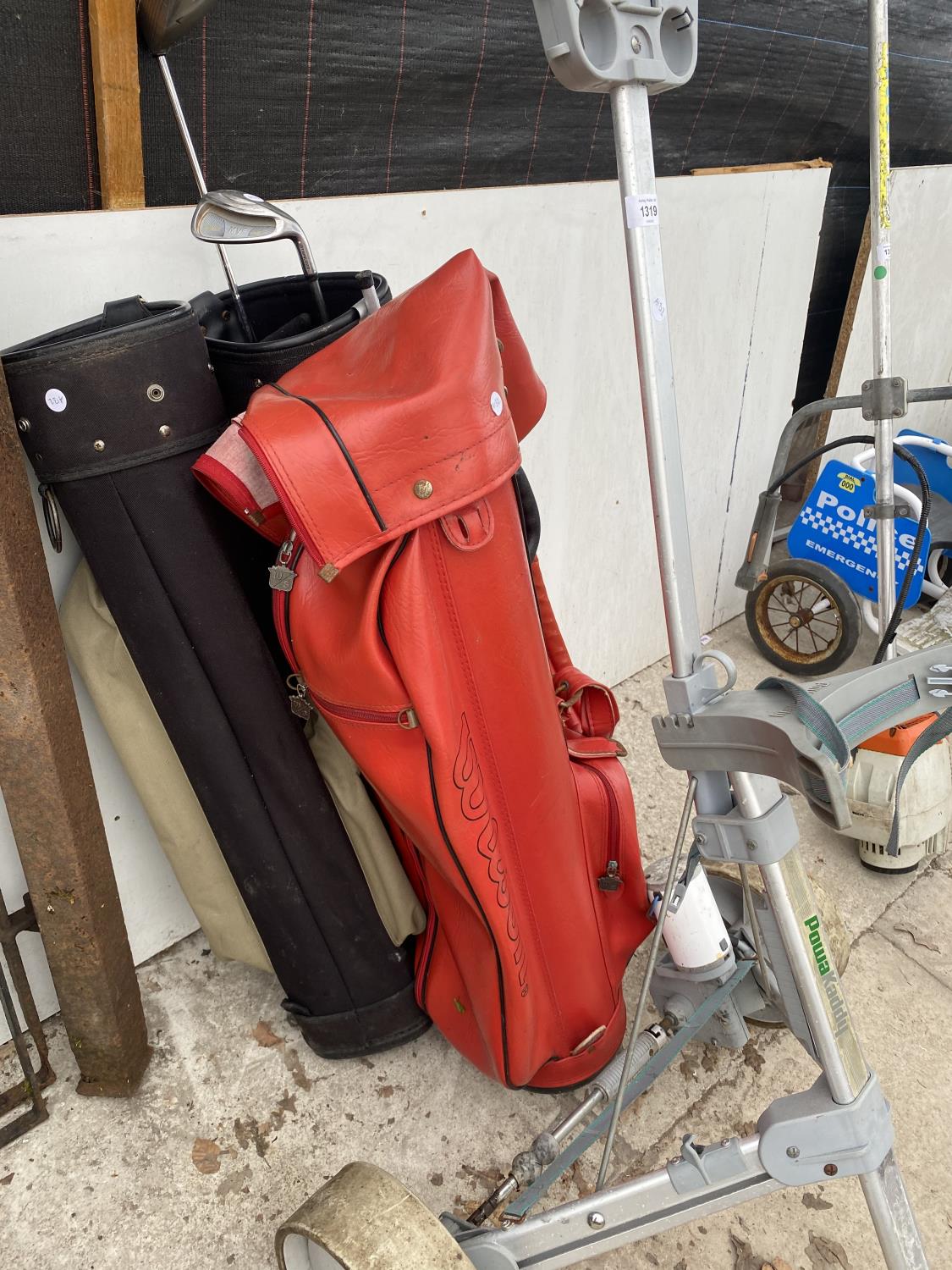 A POWAKADDY GOLF TROLLEY WITH 3 GOLF BAGS AND TWO CLUBS - Image 4 of 4