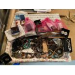 A LARGE BASKET OF COSTUME JEWELLERY TO INCLUDE NECKLACES, EARRINGS, BRACELETS, KEYRINGS AND