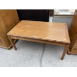 A PARKER KNOLL TEAK COFFEE TABLE