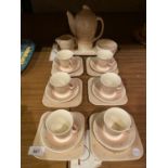 A SUSIE COOPER PRODUCTION COFFEE SET COMPRISING TRAY, COFFEE JUG, SUGAR BOWL, MILK/CREAM JUG, SIX