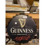 A METAL SIGN IN THE SHAPE OF A BOTTLE CAP - GUINESS DRAUGHT C:35CM