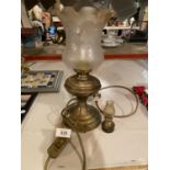 A BRASS OIL STYLE LAMP WITH FLUTED GLASS SHADE AND A MINATURE EXAMPLE
