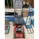 A SELF PROPELLED CHAMPION PETROL LAWN MOWER WITH GRASS BOX