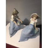 TWO NAO FIGURES OF GIRLS ONE WITH A PUPPY AND ONE WITH A BIRD