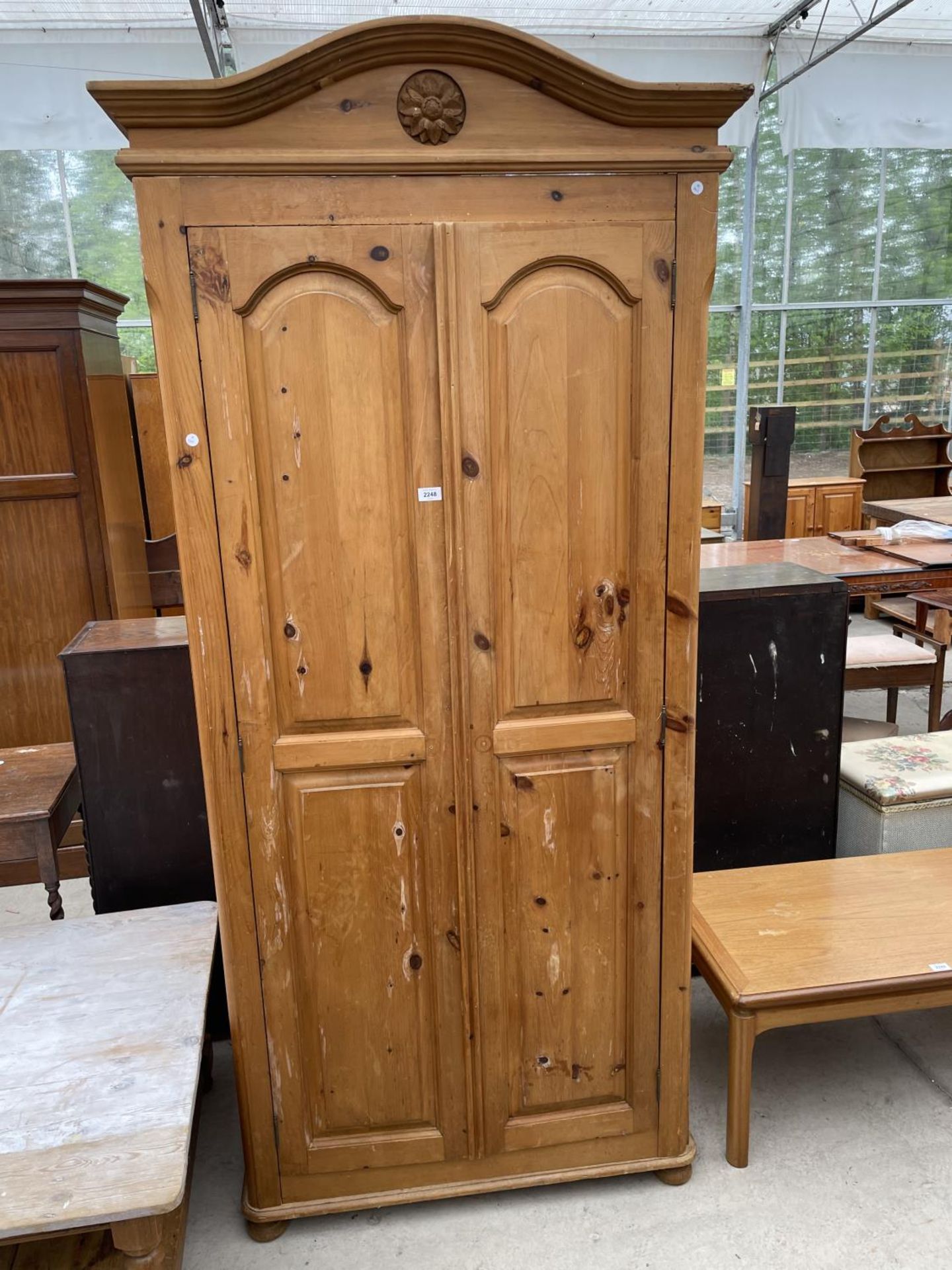 A PINE WARDROBE WITH TWO DOORS