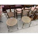 A PAIR OF MODERN WICKER CHAIRS HAVING METALWARE FRAMES WITH FOLIATE DECORATION