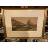 A GILT FRAMED PRINT OF A FIELD, SIGNED F LAWRENCE