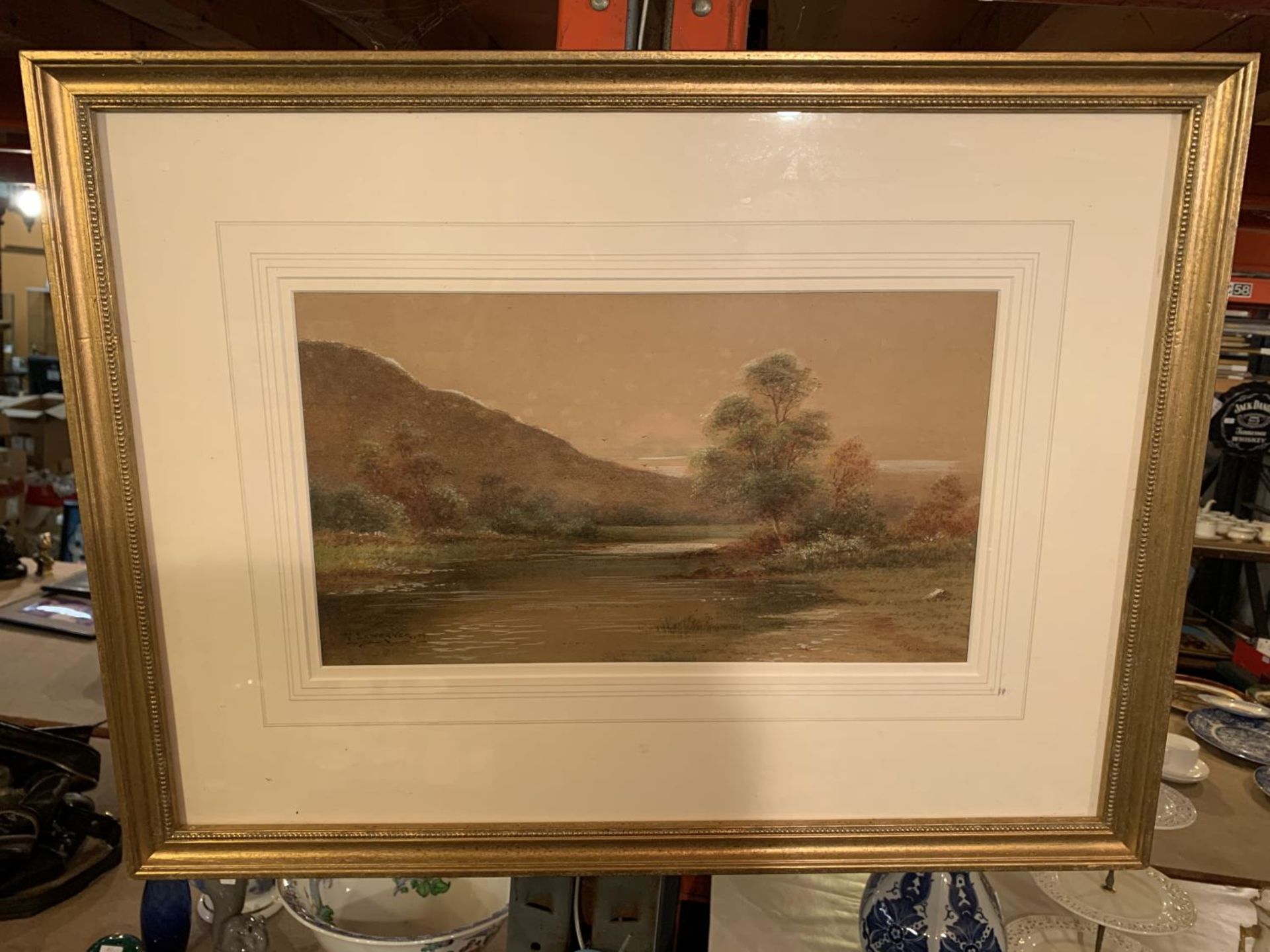 A GILT FRAMED PRINT OF A FIELD, SIGNED F LAWRENCE