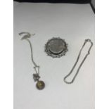 THREE ITEMS OF SILVER TO INCLUDE A BROOCH, NECKLACE WITH A STONE FOB AND A BRACELET