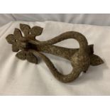 A VINTAGE METAL DOOR KNOCKER