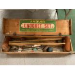 A FULL SIZE PINE BOXED JAQUES CROQUET SET TO INCLUDE FOUR MALLETS AND FULL INSTRUCTION MANUAL
