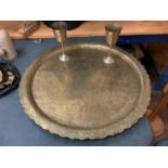 A LARGE ANTIQUE MIDDLE EASTERN BRASS CHARGER WITH FIGURAL DESIGN 61CM DIAMETER AND TWO ANTIQUE