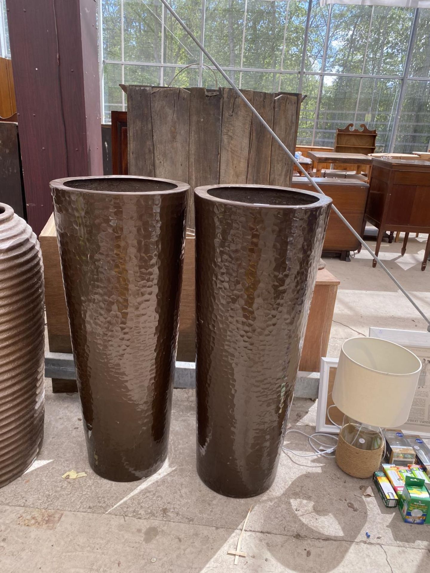 A PAIR OF DECORATIVE BROWN FIBRE GLASS PLANTERS (H:100CM)