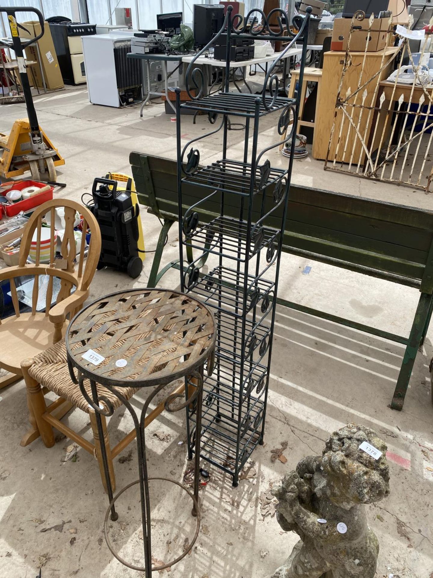 A METAL JARDINAIRE STAND AND A FURTHER 8 TIER METAL STORAGE UNIT