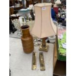 A GILT TABLE LAMP AND A PAIR OF BRASS PUSH PLATES