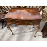 A REPRODUCTION MAHOGANY SIDE TABLE ON CABRIOLE LEGS WITH TWO DRAWERS, 30" WIDE