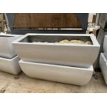 A PAIR OF RECTANGULAR FIBRE GLASS PLANTERS (75CM X 30CM X 30CM)