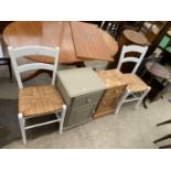 A PAINTED BEDSIDE LOCKER, PINE LOCKER AND PAIR OF RUSH SEATED CHAIRS