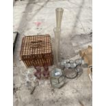 AN ASSORTMENT OF ITEMS TO INCLUDE A WICKER BASKET, CHAMPAGNE FLUTES AND CANDLE HOLDERS ETC