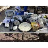 A LARGE ASSORTMENT OF ITEMS TO INCLUDE CLOCKS, EXTENSION LEADS AND A MIRROR ETC